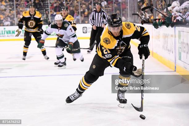 Jordan Szwarz of the Boston Bruins skates with the puck against the Minnesota Wild at the TD Garden on November 6, 2017 in Boston, Massachusetts.