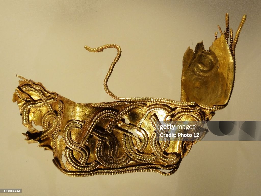Gold hilt collar from a sword.
