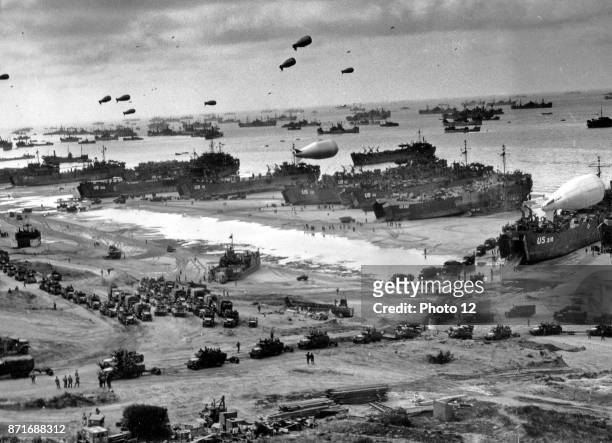 Photograph of D-Day landing craft, boats and seagoing vessels used to convey a landing force from the sea to the shore during an amphibious assault....