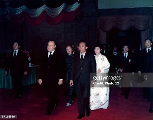 Colour photograph of Prime Minister Robert Muldoon, Lady Thea Muldoon and Park Chung Hee. Dated 1976.