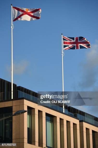 The flag of Jersey and the Union flag fly from poles atop the Royal Bank of Canada in St Helier, on the British island of Jersey, on November 8,...