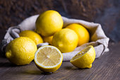Group of fresh lemon on an old vintage wooden table