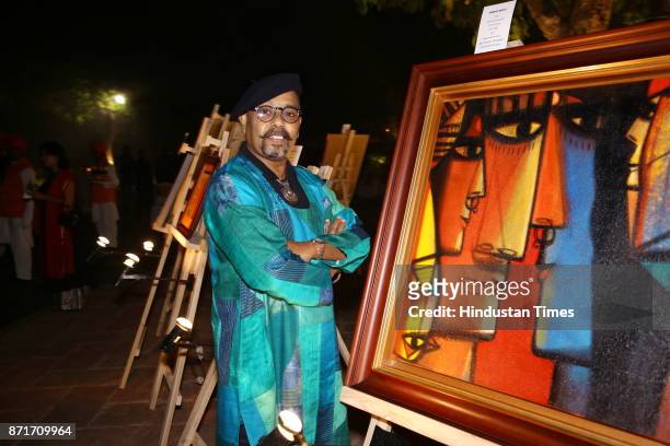 Paresh Maity with an artwork during the fundraiser for Lepra India Trust at the residence of the British High Commissioner Sir Dominic Asquith at 2...