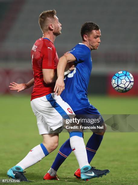 Kjartan Finnbogason of Iceland holds off Jakub Brabec of the Czech Republic during the international friendly match between Iceland and Czech...