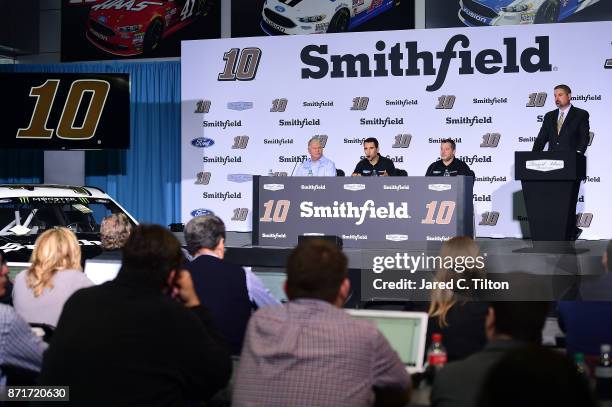 John Pauley, Executive Vice President of Sales and Marketing for Smithfield, NASCAR driver Aric Almirola, and Tony Stewart, co-owner of Stewart-Haas...