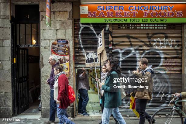 Protesters march through the Raval neighbourhood during a regional strike called by pro-independence union in Barcelona, Spain, on Wednesday, Nov. 8,...