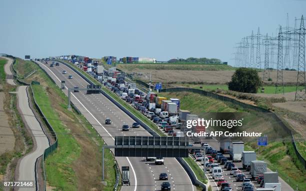 Cars stuck in a traffic jam can be seen on the motorway A4 near Erfurt, central Germany on August 20, 2010. AFP PHOTO / JOHANNES EISELE / AFP PHOTO /...