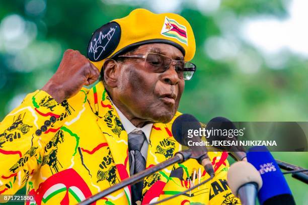 Zimbabwe's President Robert Mugabe addresses party members and supporters gathered at his party headquarters to show support to Grace Mugabe becoming...