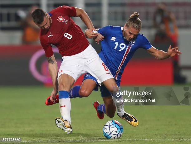 Ondrej Celustka of the Czech Republic battles with Rurik Gislason of Iceland during the international friendly match between Iceland and Czech...