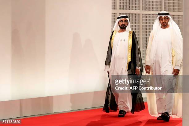 Ruler of Dubai Sheikh Mohammed bin Rashid al-Maktoum and Abu Dhabi Crown Prince Mohammed bin Zayed Al-Nahyan wait for guests at the entrance of the...