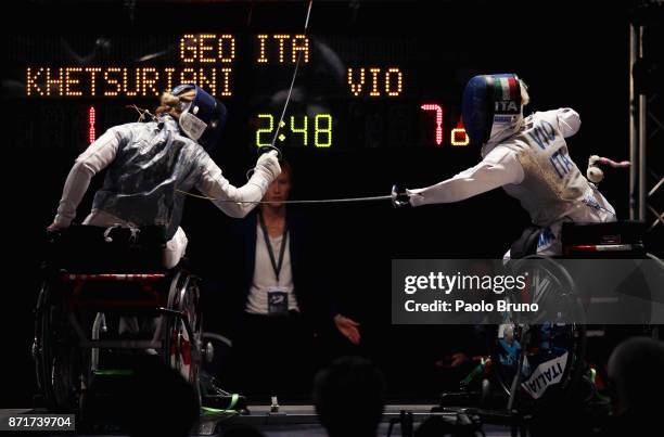 Beatrice Vio of Italy competes with Irma Khetsuriani of Georgia in the Women's Quarter-Final match foil fencing during the IWAS Wheelchair Fencing...