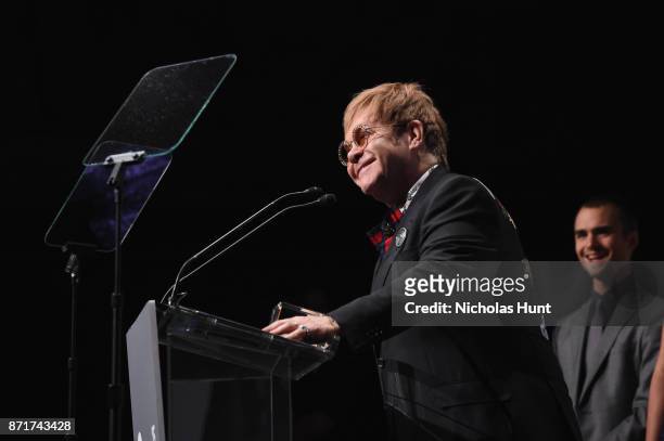 Sir Elton John speaks onstage with the Elizabeth Taylor AIDS Foundation Award at the Elton John AIDS Foundation Commemorates Its 25th Year And Honors...