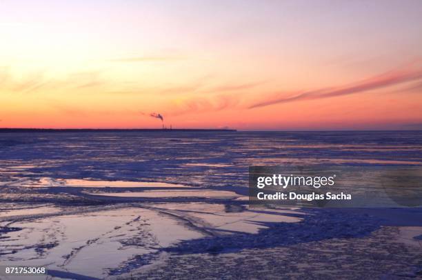 colorful sunset sky over the frozen lake - vermillion stock pictures, royalty-free photos & images