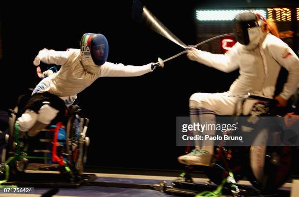 Beatrice Vio of Italy competes with Irina Mishurova of Russia in the Women's Semi-Final match foil fencing during the IWAS Wheelchair Fencing World...