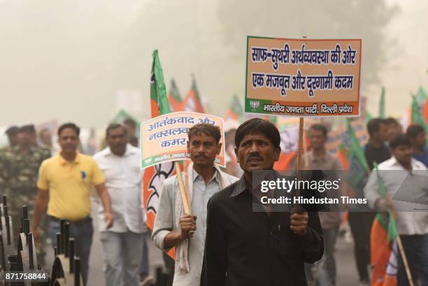 Anti Black Money Day observed by Bhartiya Janata Party leaders, activists and workers as they march from Ashoka Road to Connaught Place in support of...