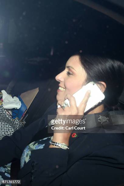 British Secretary of State for International Development Priti Patel talks on a mobile phone in a car as she arrives to Downing Street on November 8,...