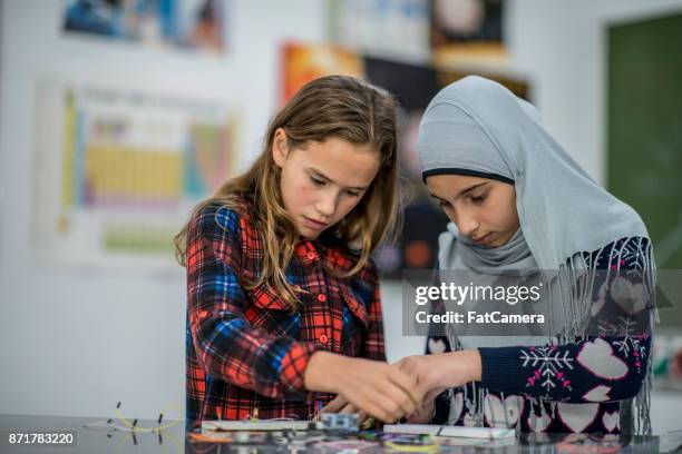 working together - headscarf stock pictures, royalty-free photos & images
