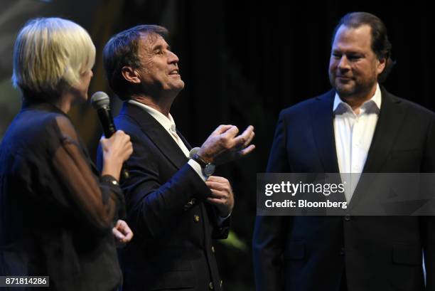 Brunello Cucinelli, chief executive officer of Brunello Cucinelli SpA, center, speaks as Marc Benioff, chairman and chief executive officer of...