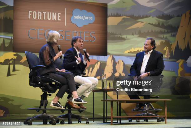 Brunello Cucinelli, chief executive officer of Brunello Cucinelli SpA, center, speaks as Marc Benioff, chairman and chief executive officer of...