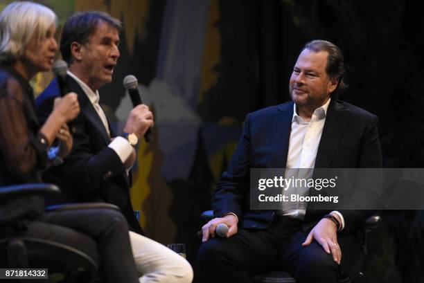 Marc Benioff, chairman and chief executive officer of Salesforce.com Inc., right, listens as Brunello Cucinelli, chief executive officer of Brunello...