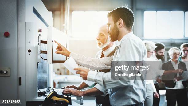 wood production facility workers. - cam imagens e fotografias de stock