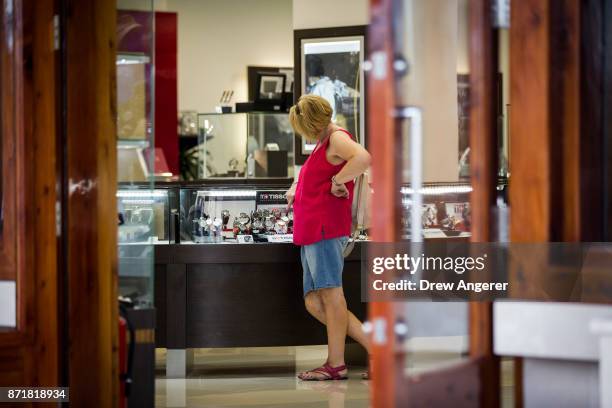 Woman shops in a high-end watch store along the commercial and retail district on Front Street, November 8, 2017 in Hamilton, Bermuda. In series of...