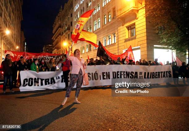 Protester with the Spanish flag during the demonstration in the Plaza de la Catedral and the Via Layetana during the general strike in Catalonia in...