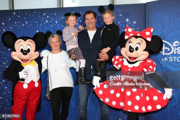 Lars Riedel with his wife Katja Riedel, daughter Paula Riedel and Emma Riedel , Mickey Mouse and Minnie Mouse during the Disney Store VIP opening on...