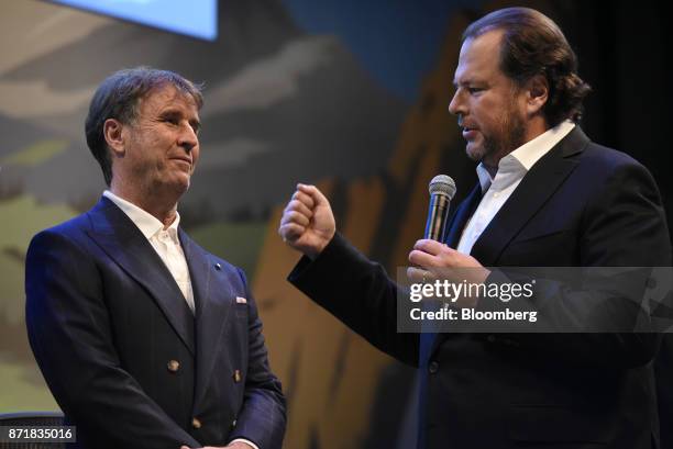 Marc Benioff, chairman and chief executive officer of Salesforce.com Inc., right, speaks as Brunello Cucinelli, chief executive officer of Brunello...