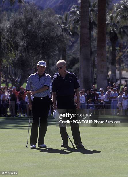 Former President Gerald Ford with PGA TOUR player Scott Hoch line up a putt during the the 1995 Bob Hope Chrysler Classic in Palm Springs, CA