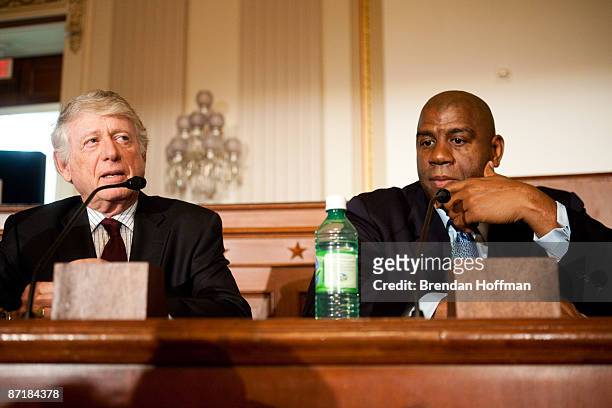 Journalist Ted Koppel speaks with former basketball player Earvin "Magic" Johnson at a forum on HIV/AIDS on Capitol Hill on May 13, 2009 in...