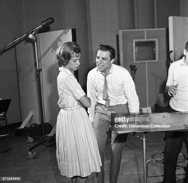 Musician Barry Mann records for JDS Records with Carole King on July 18, 1959 in New York.