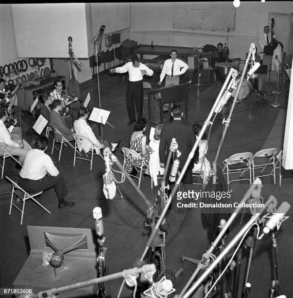 Musicians and producers Alan Lorber with at the helm at a Barry Mann recording session at RCA on September 1, 1961 in New York.