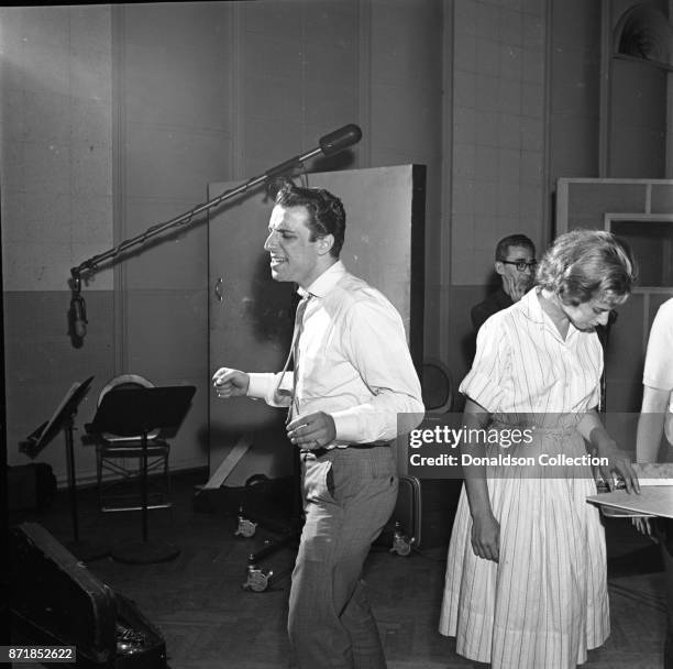 Musician Barry Mann records for JDS Records with Carole King on July 18, 1959 in New York.