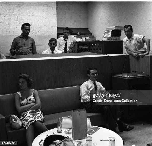 Musicians and producers including Al Nevins at a Barry Mann recording session at RCA on September 1, 1961 in New York.