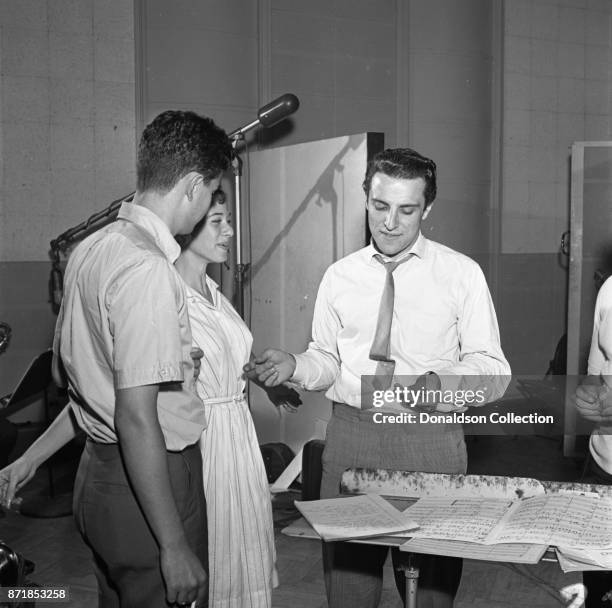 Musician Barry Mann records for JDS Records with Carole King and Gerry Goffin on July 18, 1959 in New York.