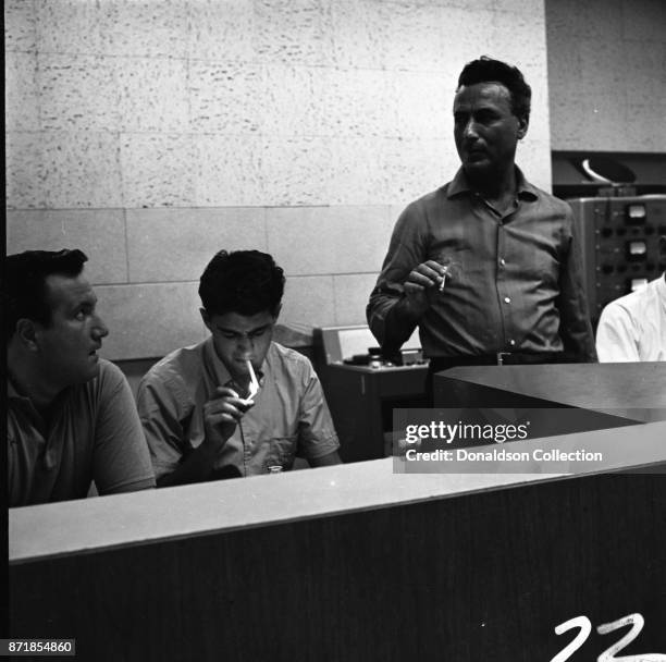 Musicians and producers Don Kirshner, Gerry Goffin and Al Nevins at a Barry Mann recording session at RCA on September 1, 1961 in New York.