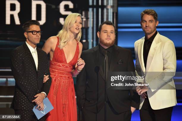 Bobby Bones, Karlie Kloss, Luke Combs, and Brett Young speak onstage at the 51st annual CMA Awards at the Bridgestone Arena on November 8, 2017 in...