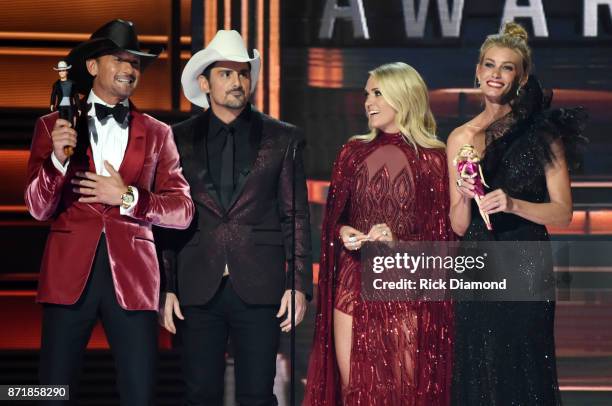Tim McGraw, Brad Paisley, Carrie Underwood, and Faith Hill speak onstage at the 51st annual CMA Awards at the Bridgestone Arena on November 8, 2017...