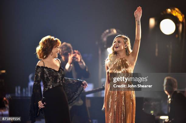 Reba McEntire and Kelsea Ballerini perform onstage at the 51st annual CMA Awards at the Bridgestone Arena on November 8, 2017 in Nashville, Tennessee.