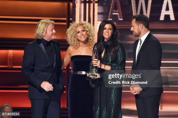 Phillip Sweet, Kimberly Schlapman, Karen Fairchild, and Jimi Westbrook accept an award onstage at the 51st annual CMA Awards at the Bridgestone Arena...