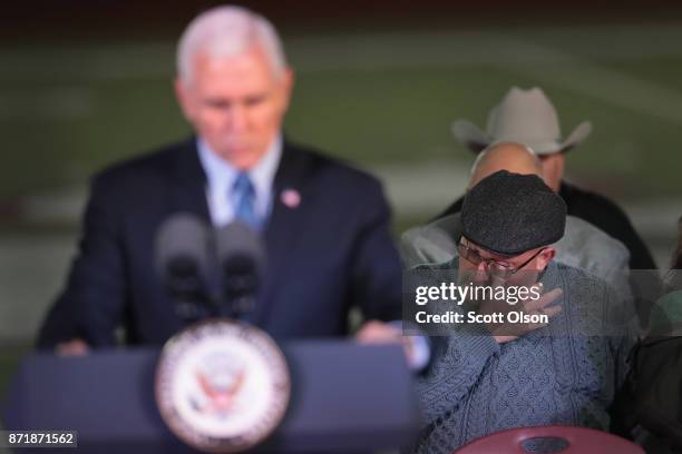 Pastor Frank Pomeroy wipes away a tear as he listens to Vice President Mike Pence speak at a memorial service for the victims of the First Baptist...