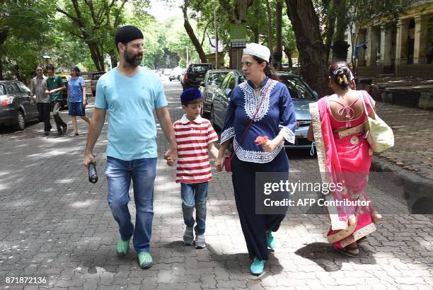 This picture taken on August 17, 2017 shows Indian Parsi Pearl Tirandaz , six months pregnant with her second child, talking with her husband Darius...