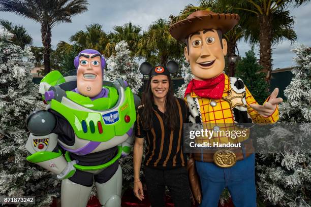 In this handout photo provided by Disney Parks, Boo Boo Stewart, with Buzz Lightyear and Woody, attends a taping of Disney Parks Presents a Disney...