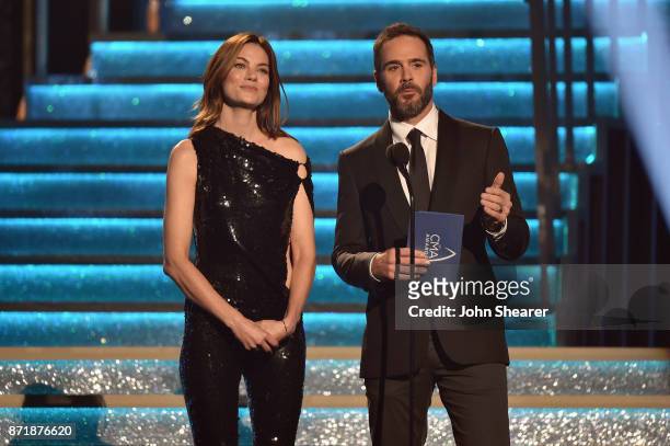 Actress Michelle Monaghan and Nascar driver Jimmie Johnson speak onstage during the 51st annual CMA Awards at the Bridgestone Arena on November 8,...