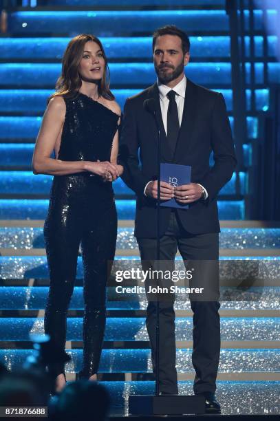 Actress Michelle Monaghan and Nascar driver Jimmie Johnson speak onstage during the 51st annual CMA Awards at the Bridgestone Arena on November 8,...