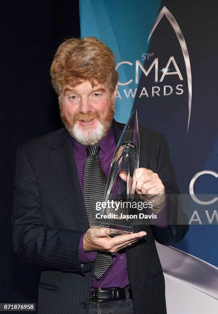 Musician Mac McAnally celebrates winning the Musician of the Year awards during the 51st annual CMA Awards at the Bridgestone Arena on November 8,...