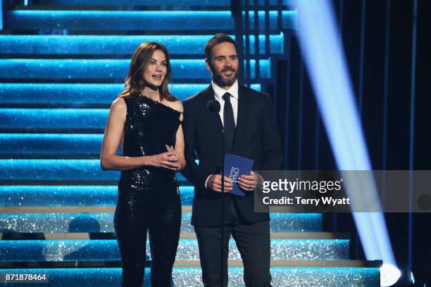 Actress Michelle Monaghan and Nascar driver Jimmie Johnson speak onstage during the 51st annual CMA Awards at the Bridgestone Arena on November 8,...