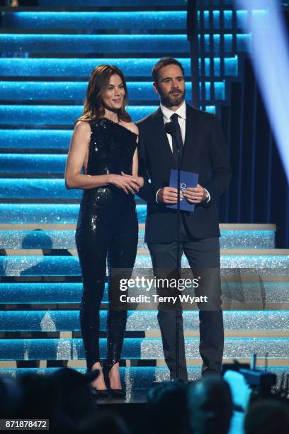 Actress Michelle Monaghan and Nascar driver Jimmie Johnson speak onstage during the 51st annual CMA Awards at the Bridgestone Arena on November 8,...