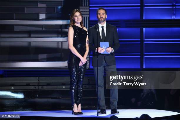 Actress Michelle Monaghan and Nascar driver Jimmie Johnson speak onstage during the 51st annual CMA Awards at the Bridgestone Arena on November 8,...